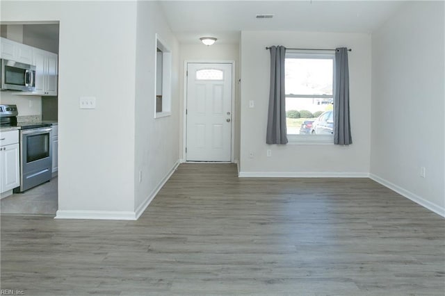 entryway with light hardwood / wood-style floors