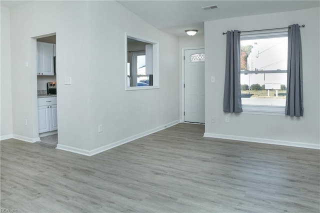 empty room with light wood-type flooring