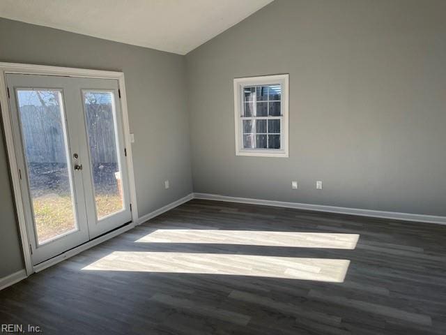 unfurnished room featuring french doors, dark hardwood / wood-style floors, and lofted ceiling