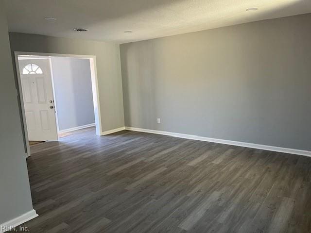 foyer entrance with dark hardwood / wood-style floors