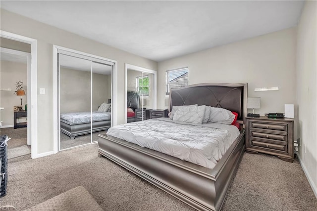 carpeted bedroom featuring a closet