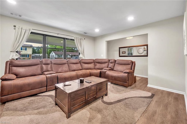 living room with light hardwood / wood-style floors