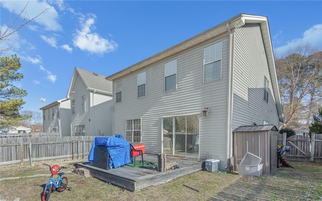 back of property with a storage unit