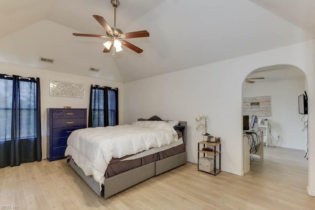 bedroom featuring light wood-type flooring, ceiling fan, and lofted ceiling