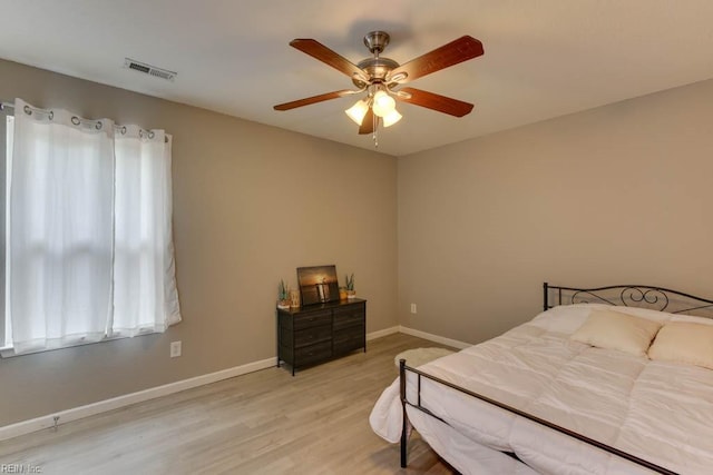 bedroom featuring wood-type flooring and ceiling fan