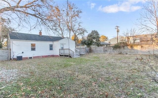 view of yard with cooling unit and a wooden deck