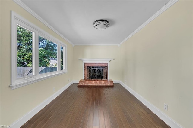 unfurnished living room with a fireplace, ornamental molding, and dark wood-type flooring