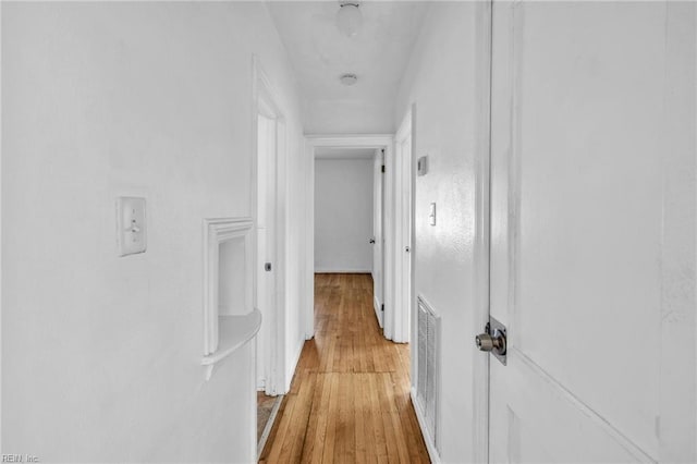 corridor featuring light wood-type flooring