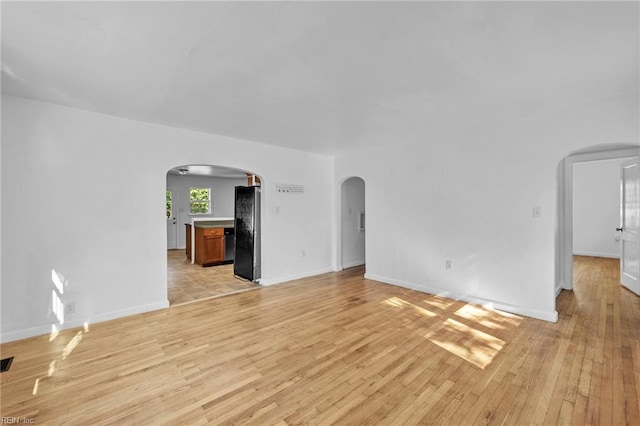 unfurnished living room featuring light wood-type flooring