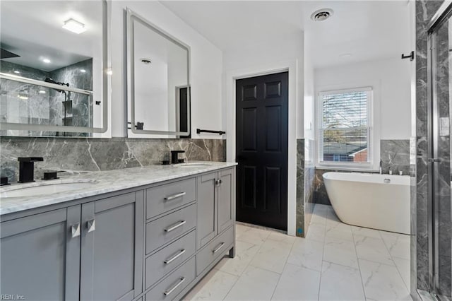 bathroom with vanity, independent shower and bath, and tile walls