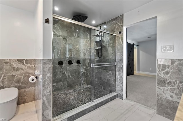 bathroom with a shower with shower door, tile walls, and toilet