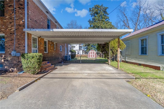 view of parking / parking lot with a carport and a lawn