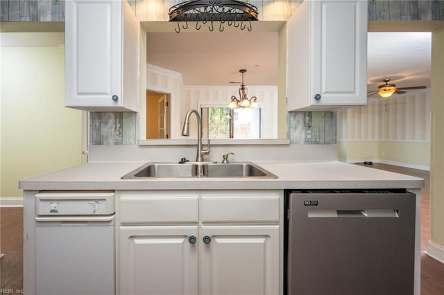 kitchen featuring white cabinetry, dishwasher, and sink