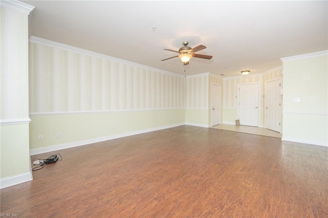 unfurnished room with hardwood / wood-style floors, ceiling fan, and crown molding