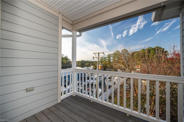 wooden deck featuring a water view