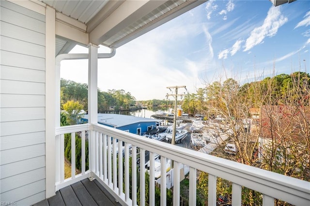 balcony featuring a water view