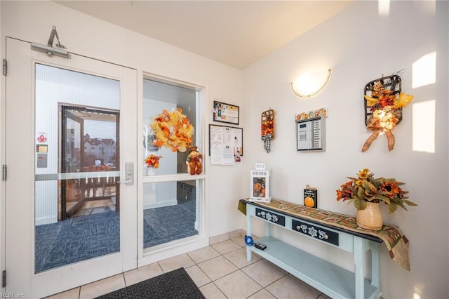 entryway featuring light tile patterned floors