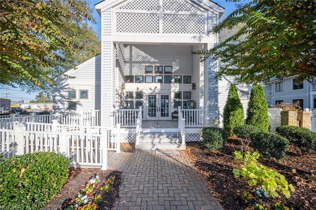 rear view of house featuring a balcony