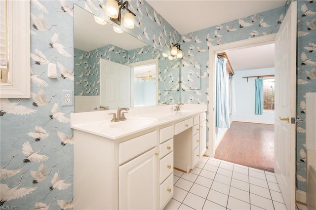 bathroom with tile patterned flooring and vanity