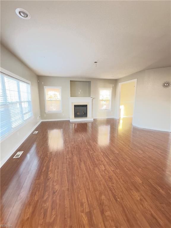 unfurnished living room with hardwood / wood-style floors