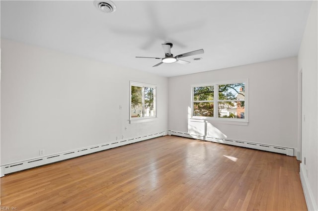 empty room with ceiling fan, a baseboard radiator, and light hardwood / wood-style flooring