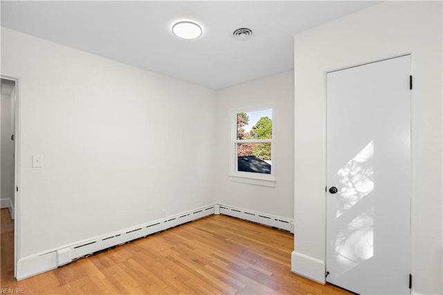 empty room featuring hardwood / wood-style flooring