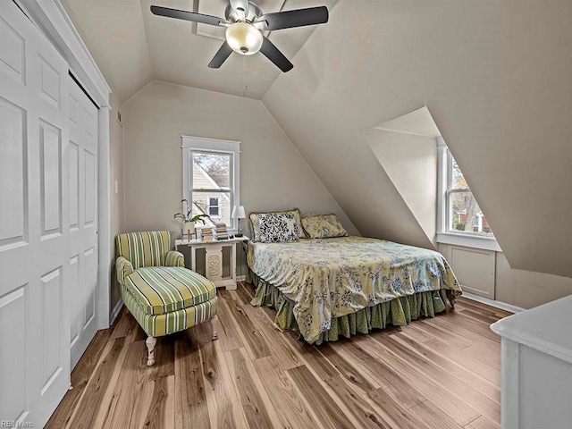 bedroom featuring hardwood / wood-style flooring, ceiling fan, and a closet