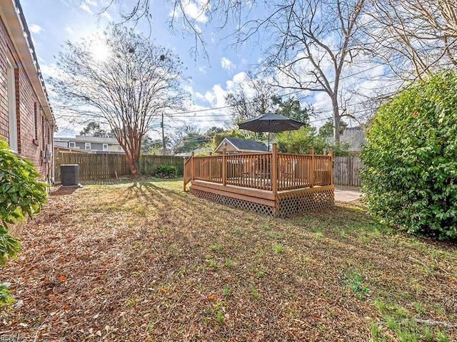 view of yard featuring cooling unit and a wooden deck