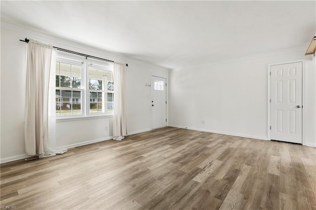 unfurnished living room with light wood-type flooring and ornamental molding