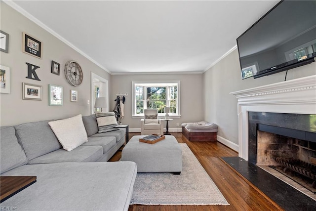 living room with dark hardwood / wood-style flooring and ornamental molding