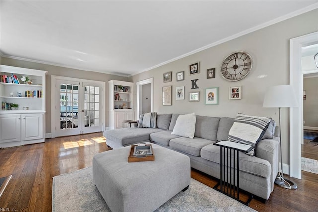 living room featuring french doors, ornamental molding, and dark wood-type flooring