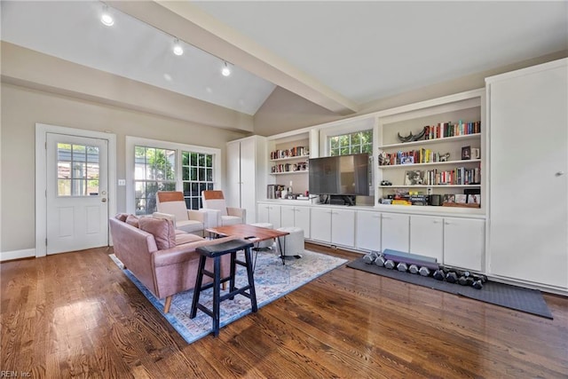 living room featuring built in features, dark hardwood / wood-style floors, and lofted ceiling