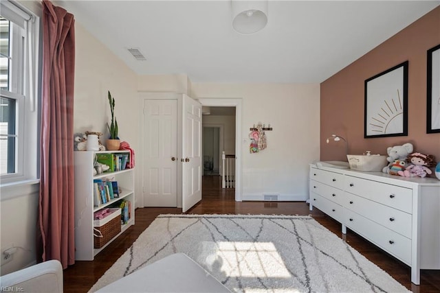 bedroom featuring dark hardwood / wood-style flooring