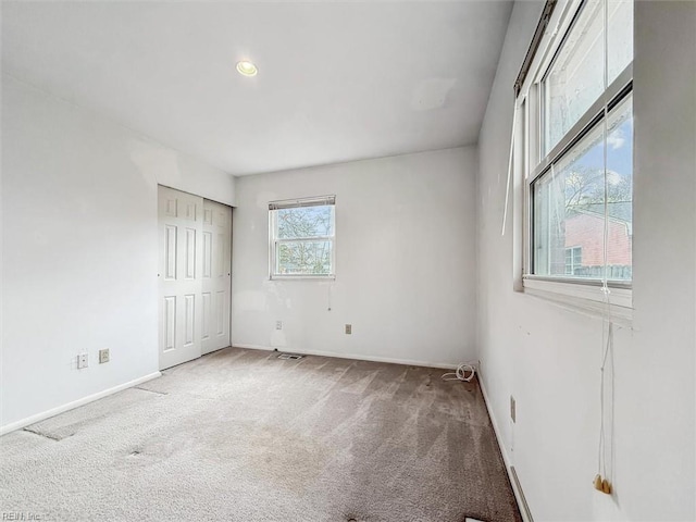 unfurnished bedroom with carpet floors