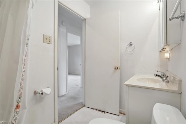 bathroom with vanity and toilet