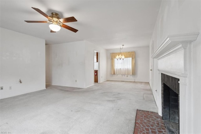 unfurnished living room with carpet flooring and ceiling fan with notable chandelier