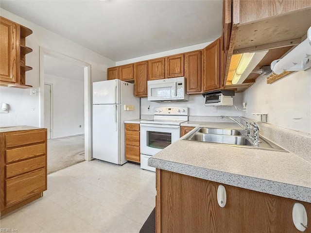 kitchen with white appliances and sink