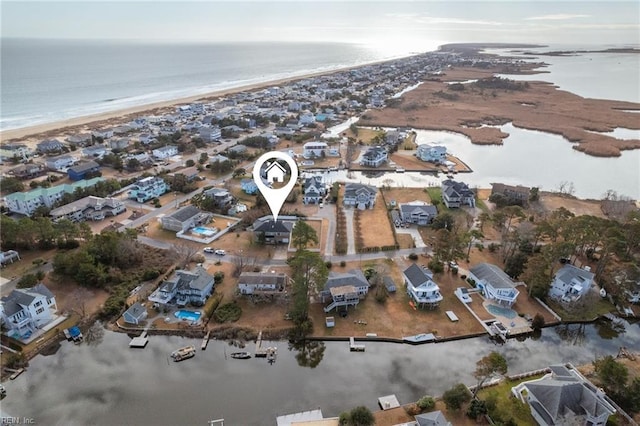 bird's eye view featuring a beach view and a water view