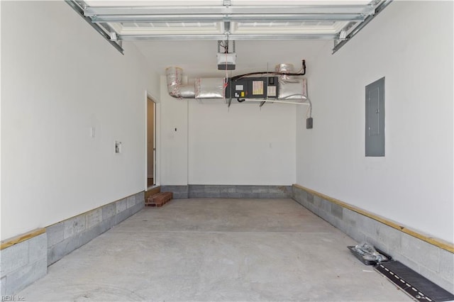 garage with electric panel and a garage door opener