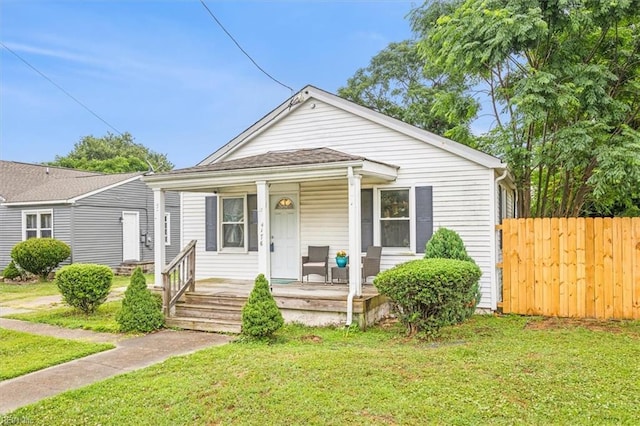 bungalow-style home with a porch and a front lawn