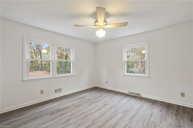 spare room with ceiling fan and light hardwood / wood-style flooring