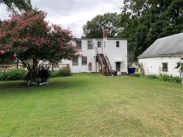 back of house with a yard