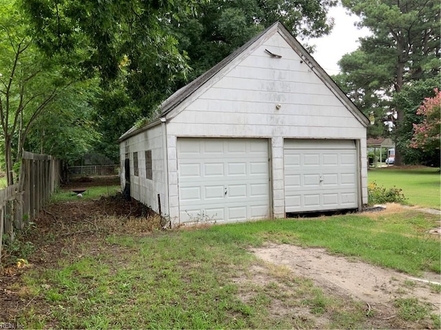 garage with a yard