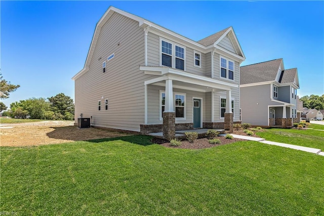 craftsman house with a front lawn and central AC unit