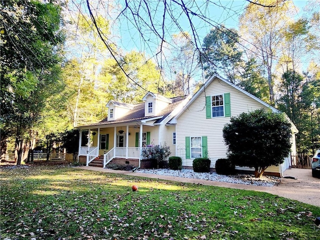 cape cod-style house with a porch and a front lawn