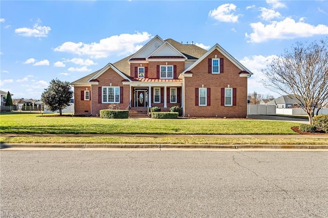 craftsman-style house featuring a front yard