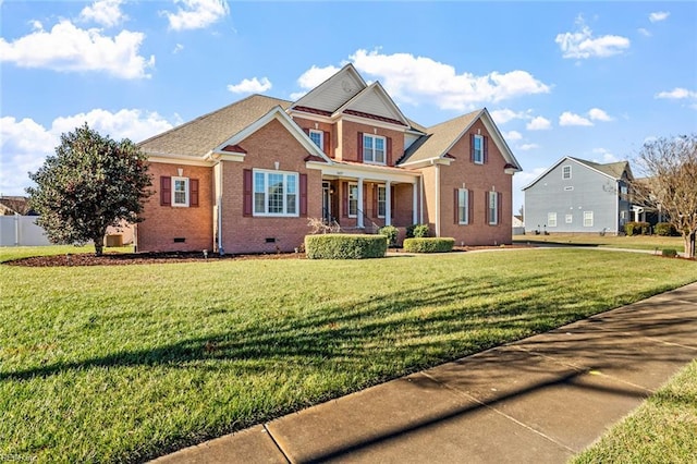 view of front facade with covered porch and a front yard