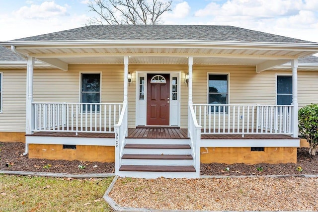 doorway to property featuring covered porch