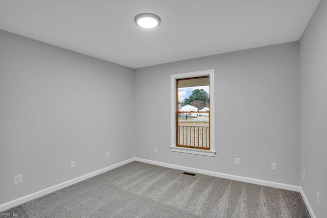 unfurnished room with carpet flooring