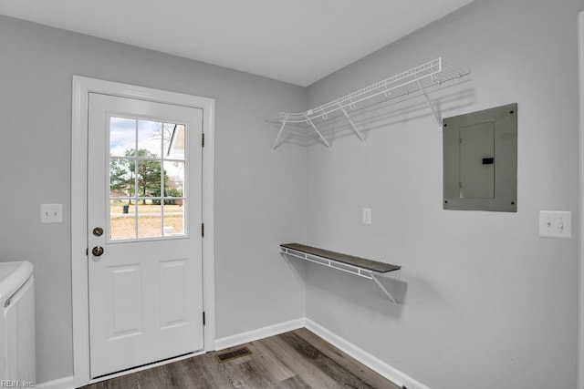 interior space featuring electric panel and dark wood-type flooring